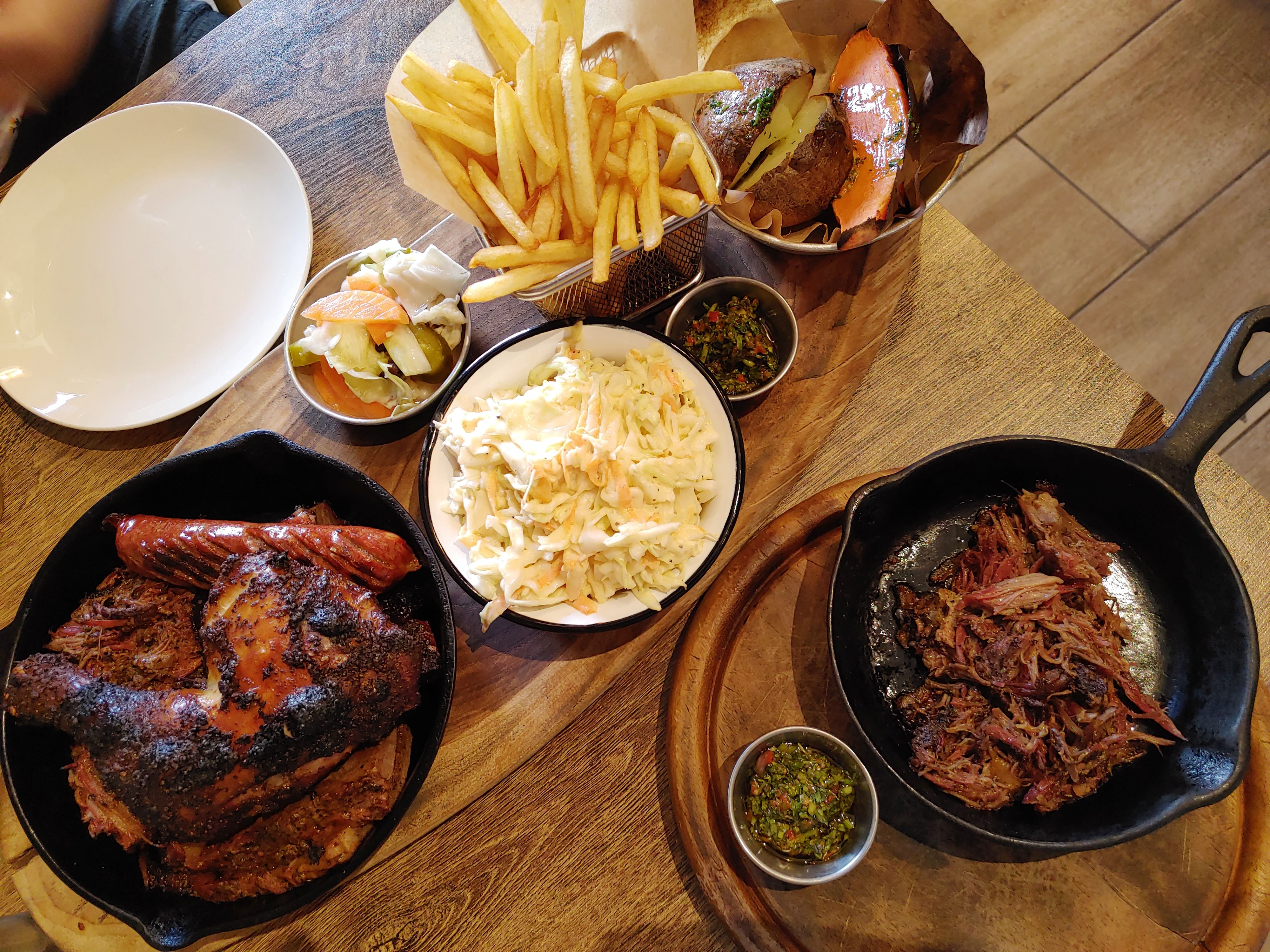Slow-cooked meats and sides at Brisket Bar
