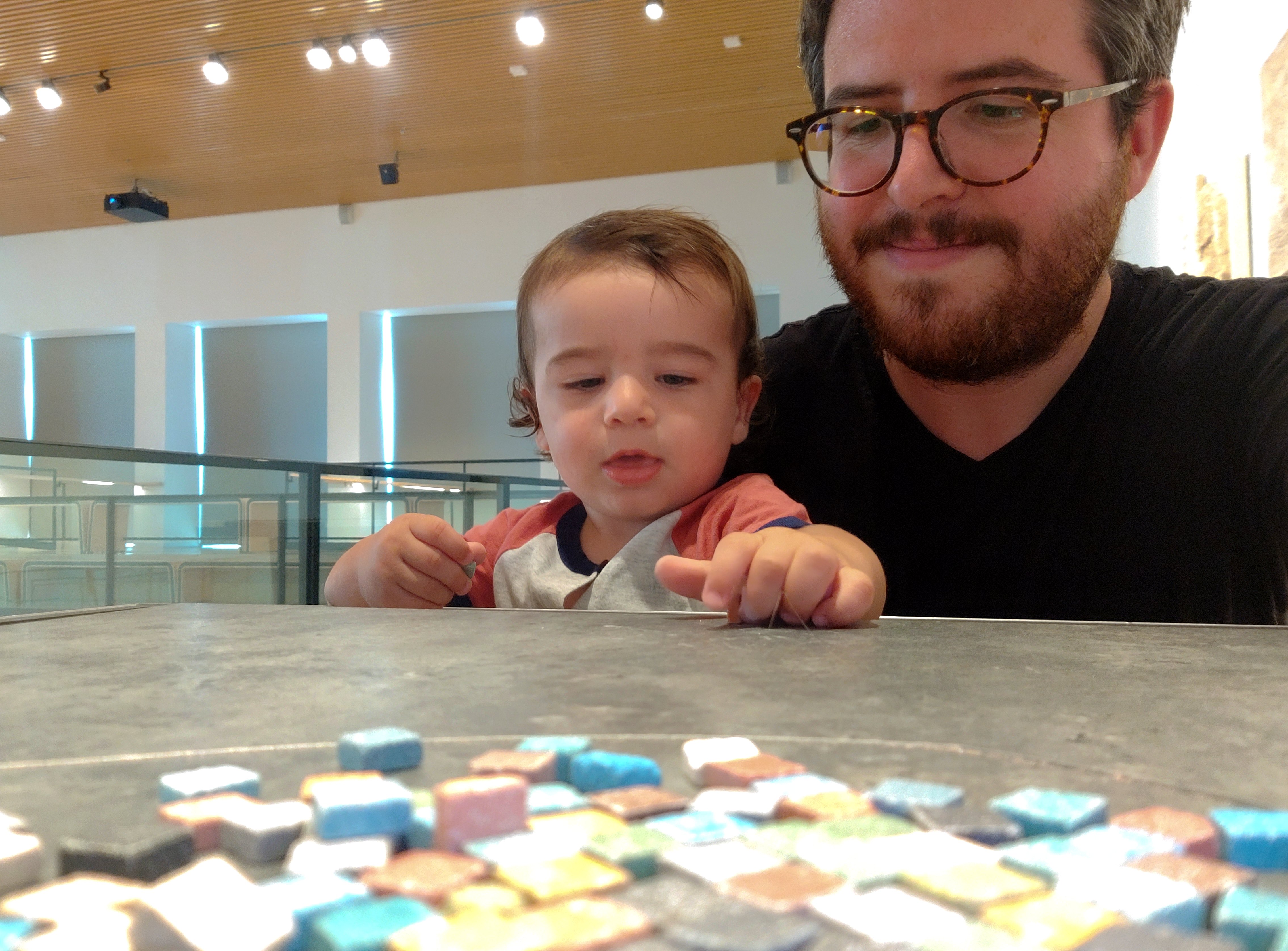 Amir playing with the mock mosaic tiles