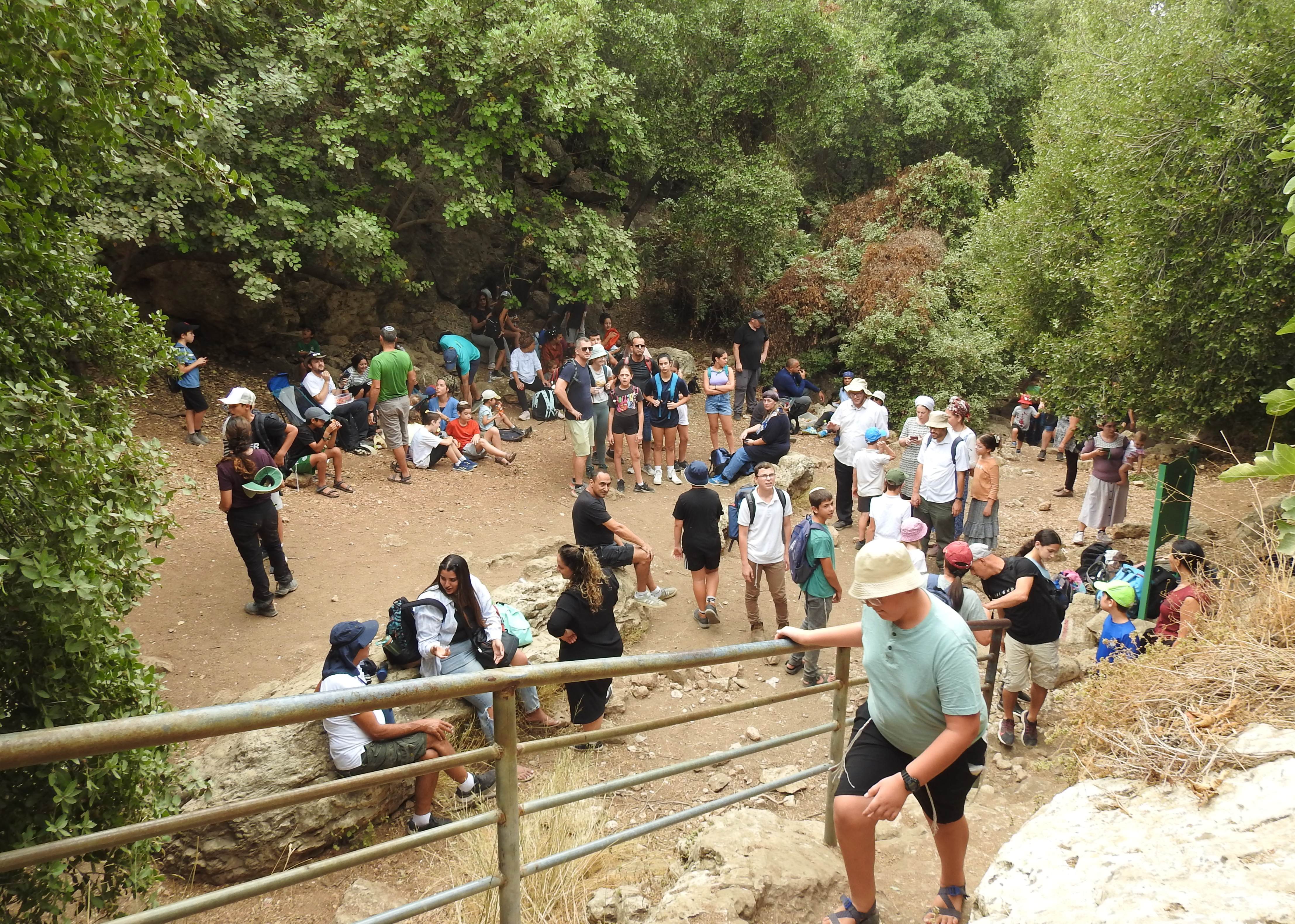 Loads of people outside the cave